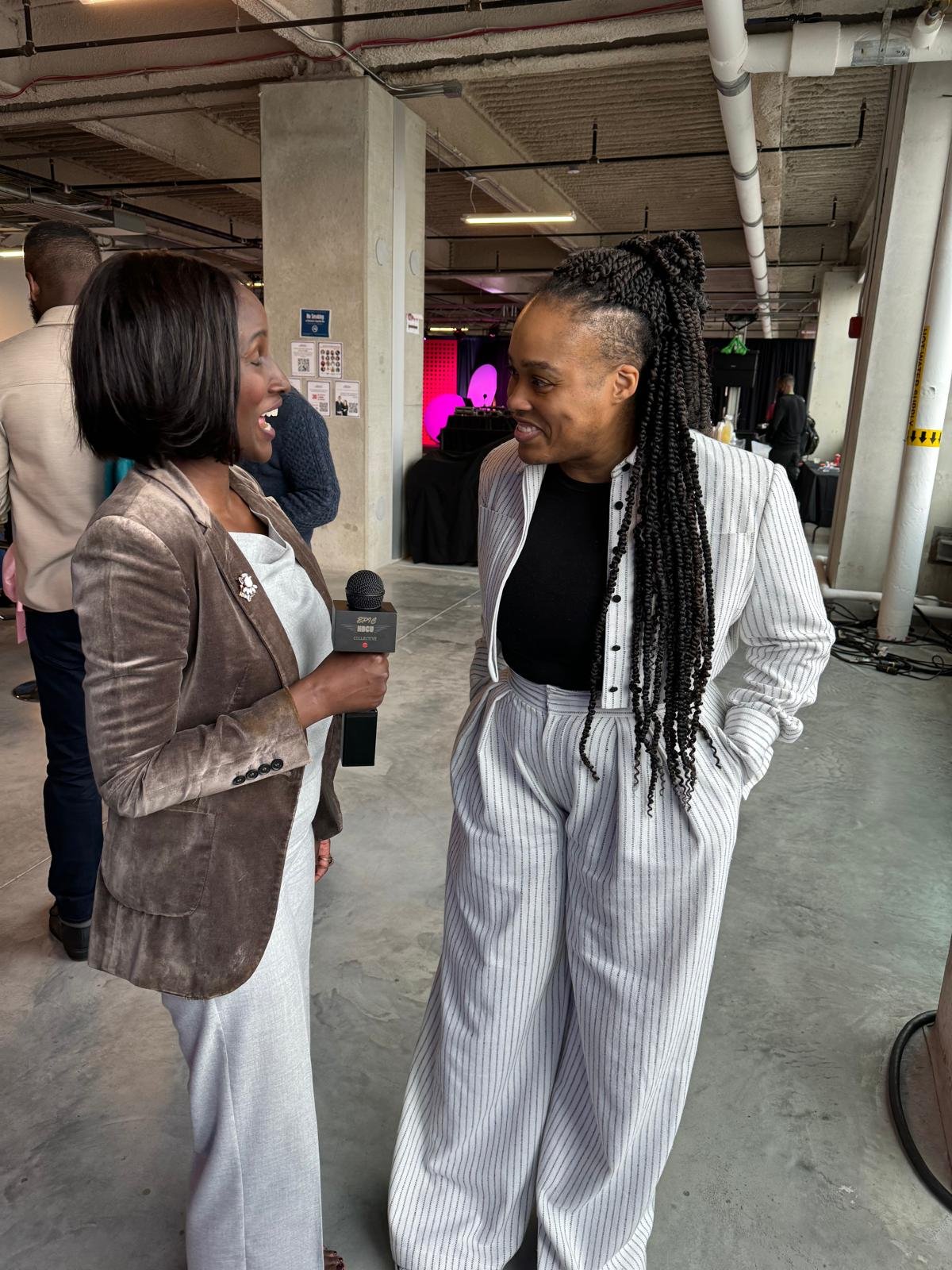 Rica Elysée being interviewed on camera at an event