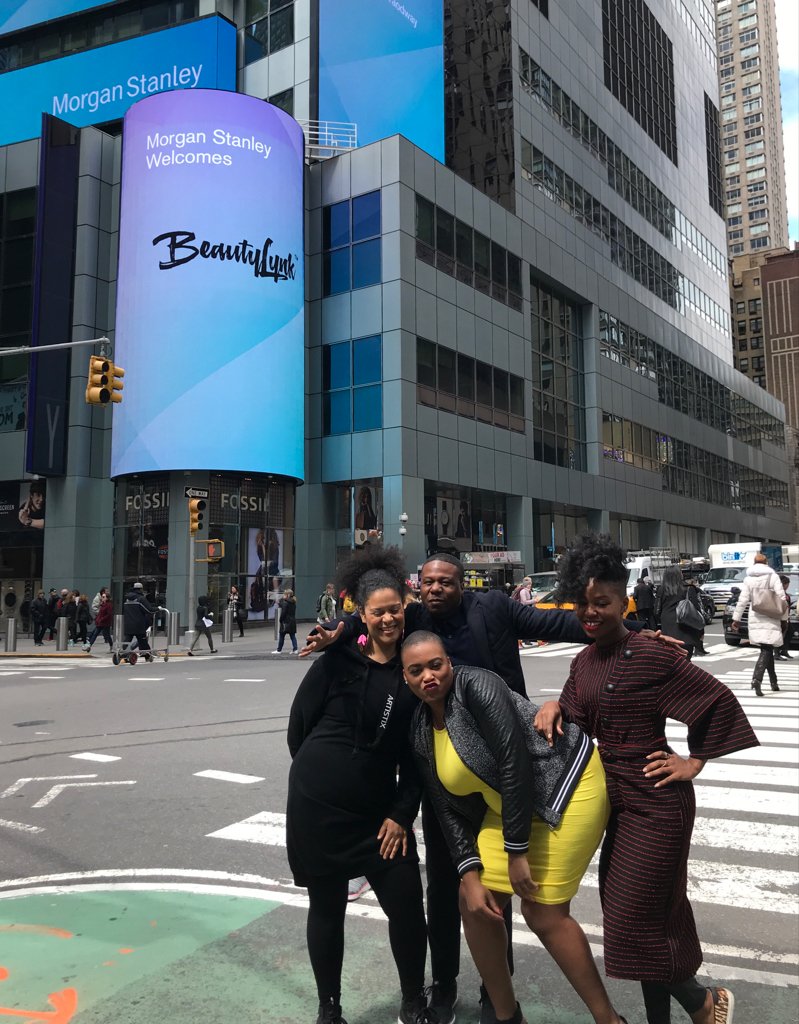 'Morgan Stanley Welcomes BeautyLynk' on a Times Square screen, with the BeautyLynk group posing below